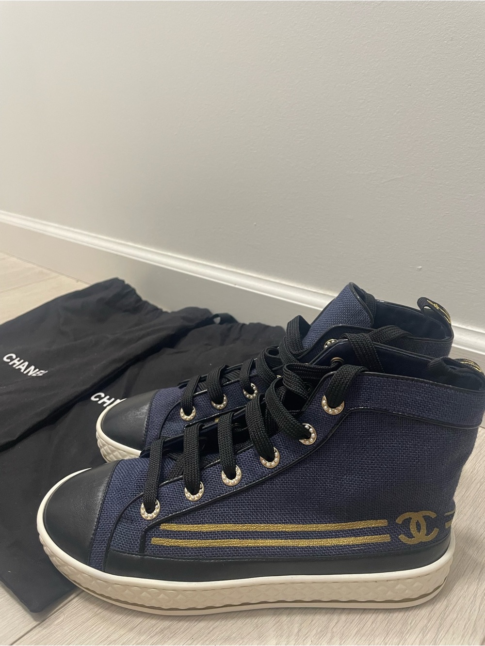 CHANEL High-Top Sneakers with Gold CC Detail